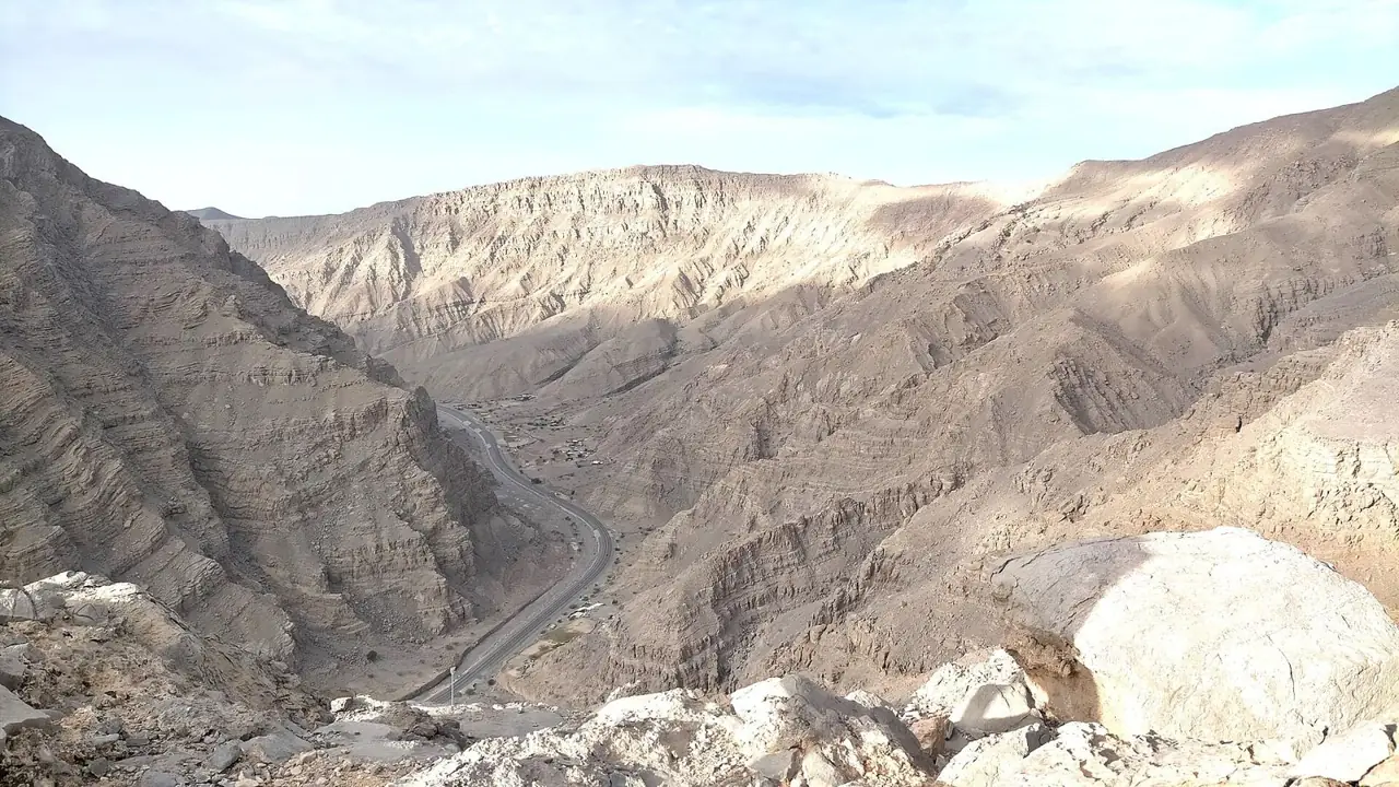 The Wadi Shah gorge cutting through bare limestone mountains on Jebel Jais