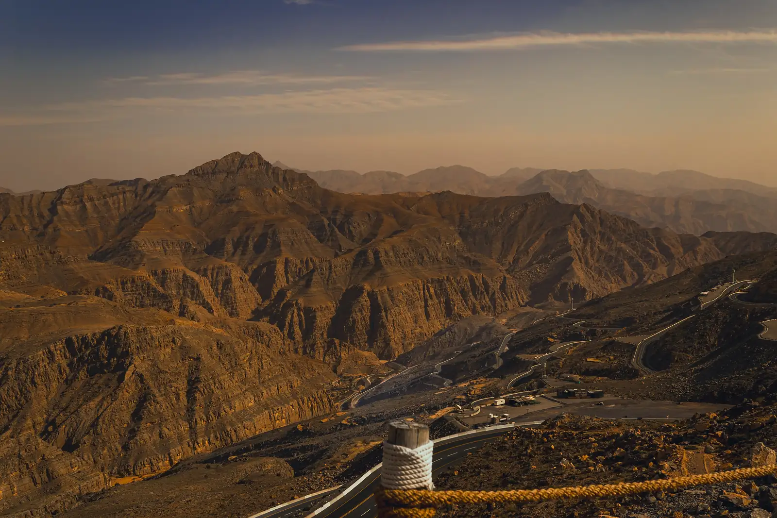 Sunset over the Hajar peaks of Jebel Jais, with the switchback road below