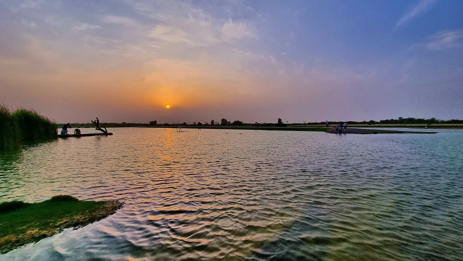 Sunset over the water at Love Lake, Al Qudra, Dubai